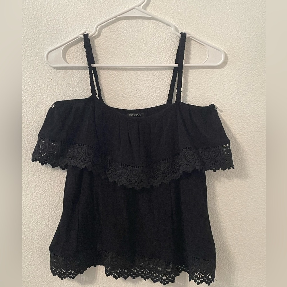 This is a black tank top with off the shoulder sleeves with lace at the bottom